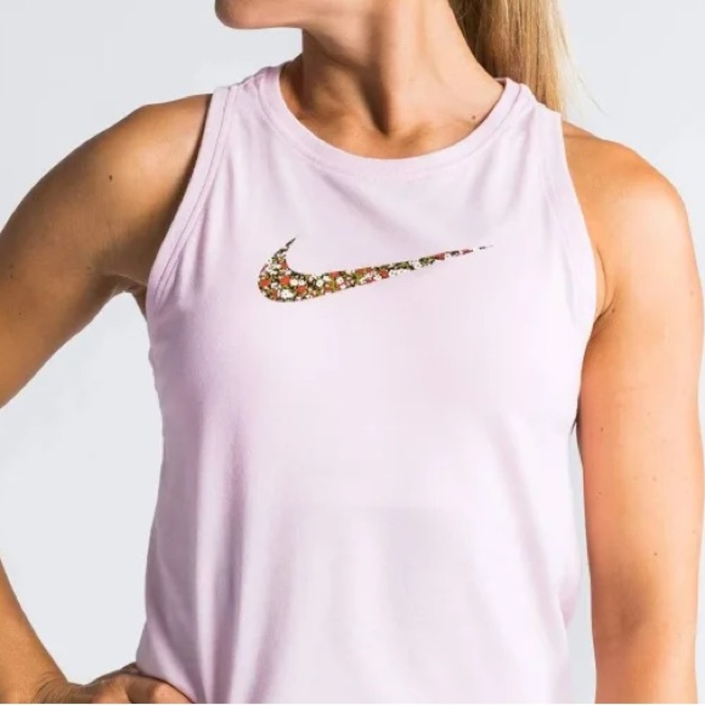 Medium Light Pink Nike Tank with floral swoosh. Good condition.